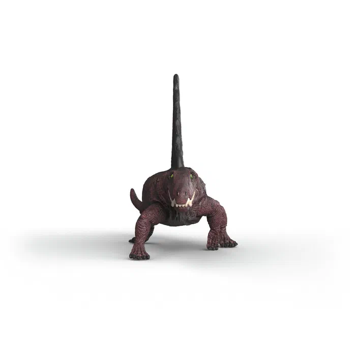 Figurine du Dimetrodon rouge à écailles avec une grande nageoire dorsale sombre dressée.