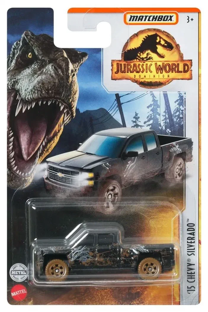 Camionnettes Matchbox '15 Chevy Silverado dans son emballage Jurassic World Dominion, montrant un T-Rex et la voiture noire avec des marques de boue.