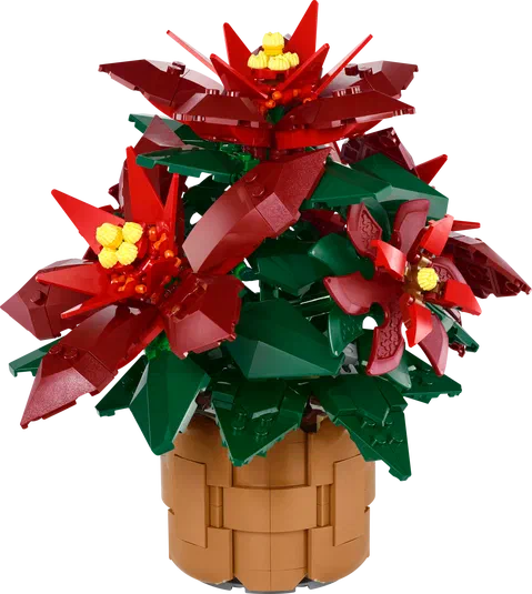 Plante de poinsettia construite avec des briques LEGO, présentant plusieurs fleurs rouges et jaunes ainsi que des feuilles vertes dans un pot marron.