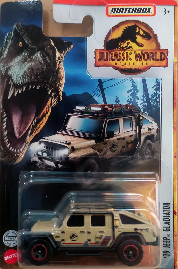 Voiture Matchbox '19 Jeep Gladiator Jurassic World Dominion dans son emballage avec un fond illustrant le logo et un dinosaure.
