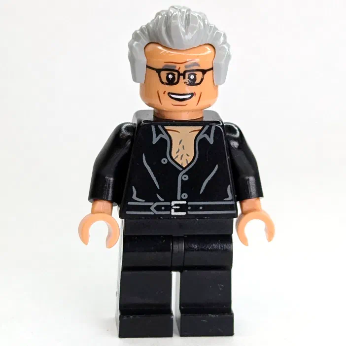 Minifigurine LEGO de Jurassic World avec cheveux gris, lunettes et veste noire.