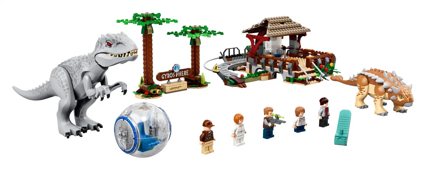 Ensemble de jeu de construction LEGO Jurassic World montrant une Indominus rex grise, la structure du Gyrosphere avec des palmiers, un Ankylosaurus marron et plusieurs minifigurines.