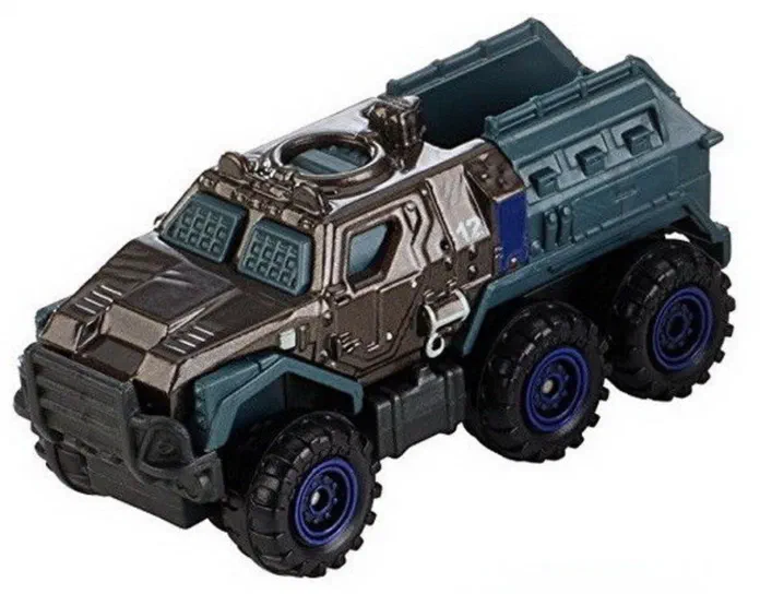Un camion jouet à six roues avec des pneus larges aux jantes bleues, une cabine gris foncé et un compartiment arrière vert-bleu sur fond blanc.