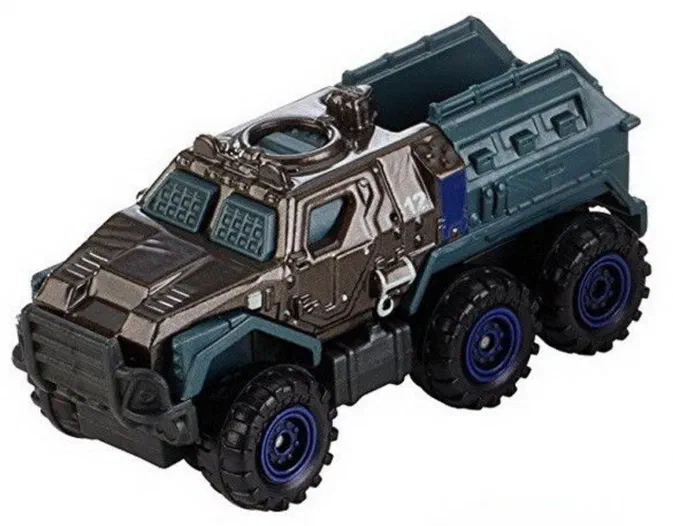 Un camion jouet à six roues avec des pneus larges aux jantes bleues, une cabine gris foncé et un compartiment arrière vert-bleu sur fond blanc.