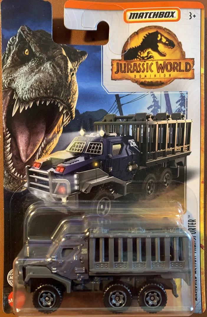 Voiture de collection Matchbox Armored Action Transporter (HBH11) dans son packaging officiel Jurassic World Dominion avec un T-Rex en arrière-plan.