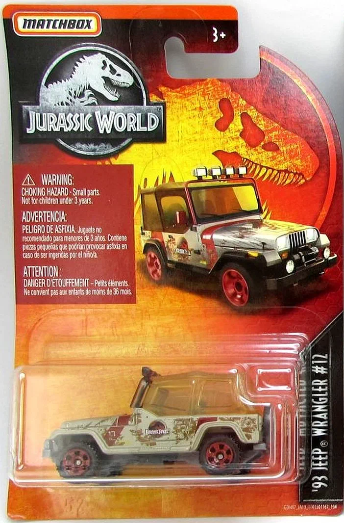 Un emballage Matchbox du véhicule tout-terrain Jeep Wrangler numéroté 12, thème Jurassic World, visible à travers une fenêtre en plastique sur un fond de carte illustrée d'un dinosaure.