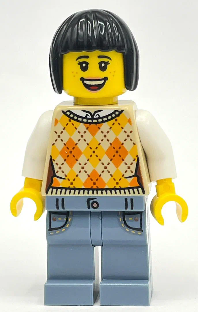 Minifigurine LEGO avec une perruque noire et un pull orange à motif losange.
