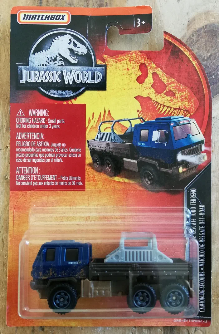 Packaging Matchbox Jurassic World Off-Road Rescue Rig bleu et noir avec logo T-Rex