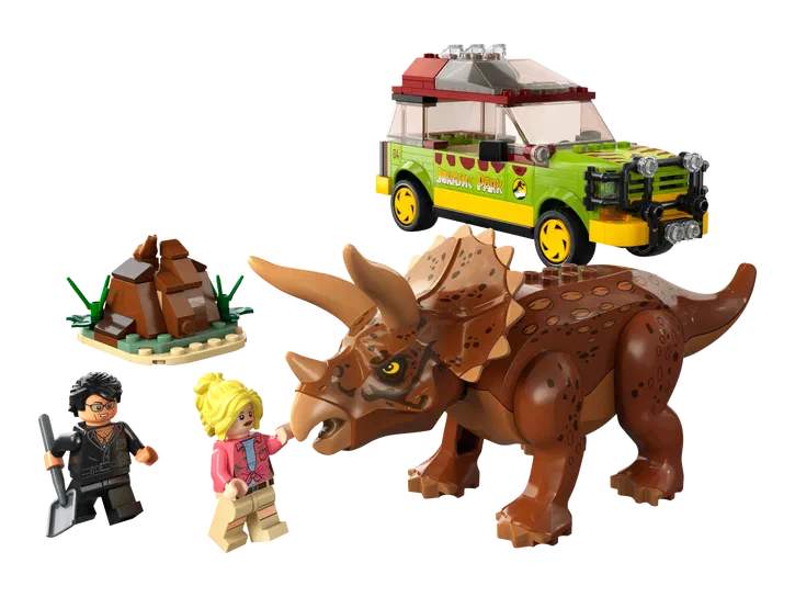 Ensemble de figurines LEGO Jurassic World incluant un Tricératops, une voiture et deux personnages.