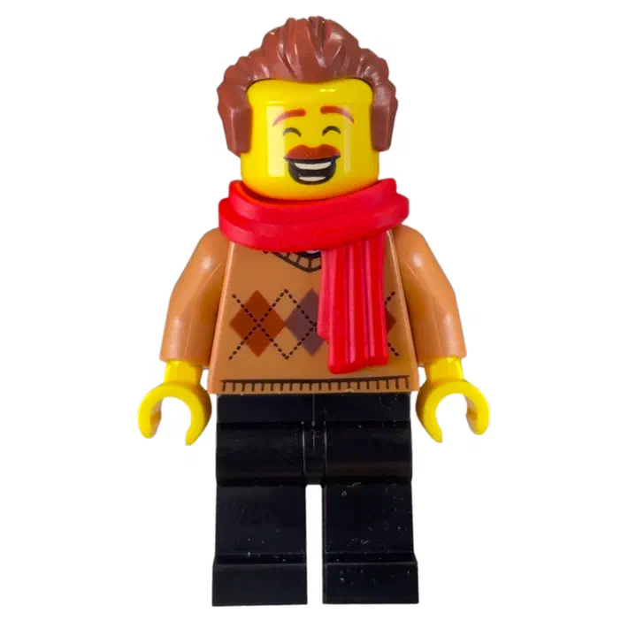 Minifigurine LEGO avec une écharpe rouge et un pull marron à motif argyle.