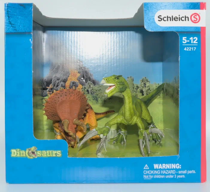 Boîte de jeu Schleich Dinosaures n°42217 avec un Tricératops et un Allosaurus en combat