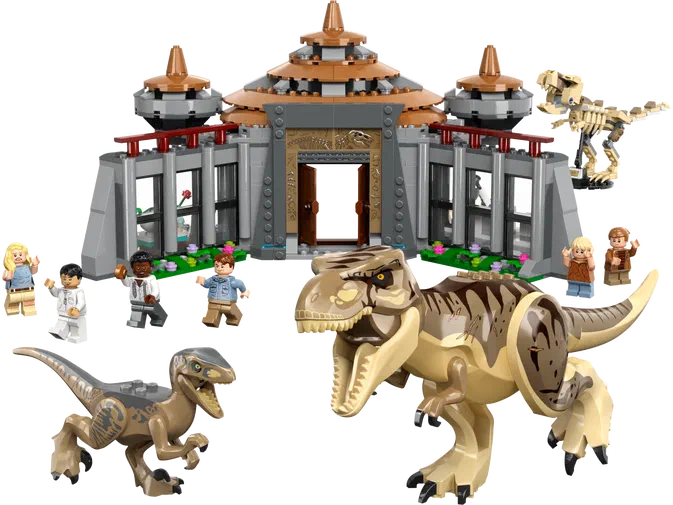 Ensemble de construction LEGO Jurassic World avec un bâtiment, des dinosaures et plusieurs personnages.