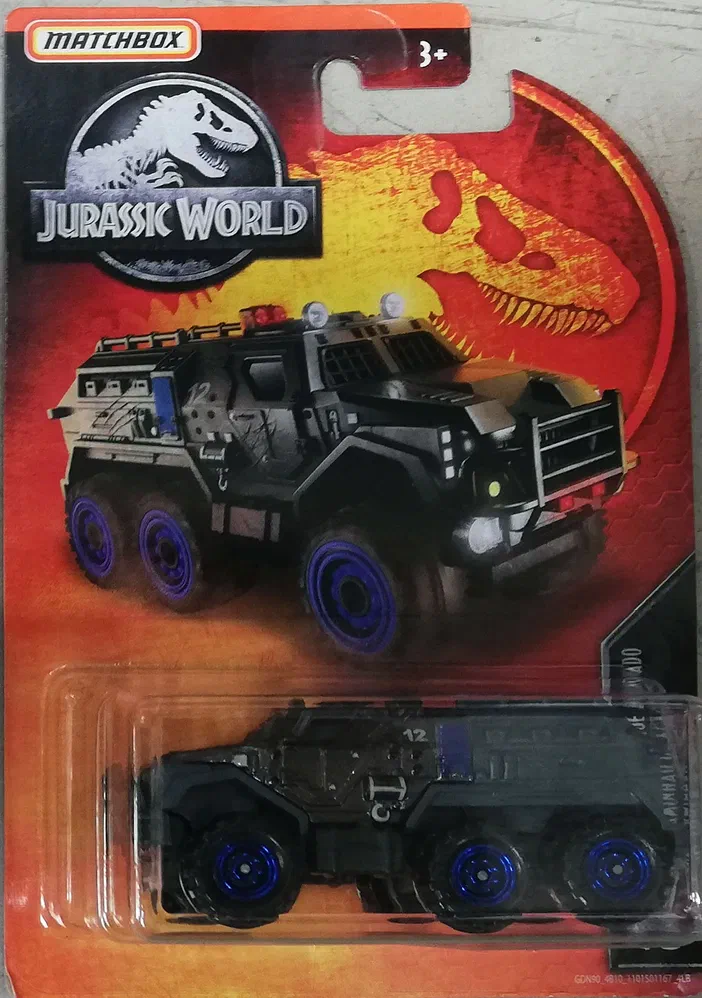 Packaging Matchbox Armored Action Truck Jurassic World avec le véhicule noir et les roues bleues visibles dans la fenêtre transparente.
