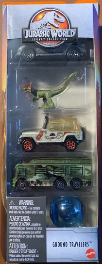 Boîte de jouets Jurassic World Legacy Collection contenant quatre véhicules Matchbox et une sphère bleue