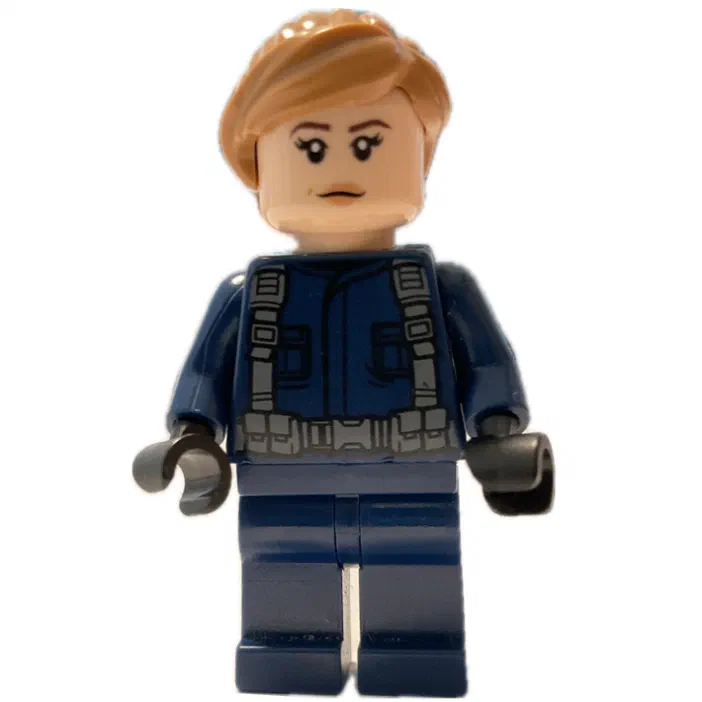 Minion de LEGO Jurassic World : une figurine avec des cheveux blonds et un uniforme bleu.