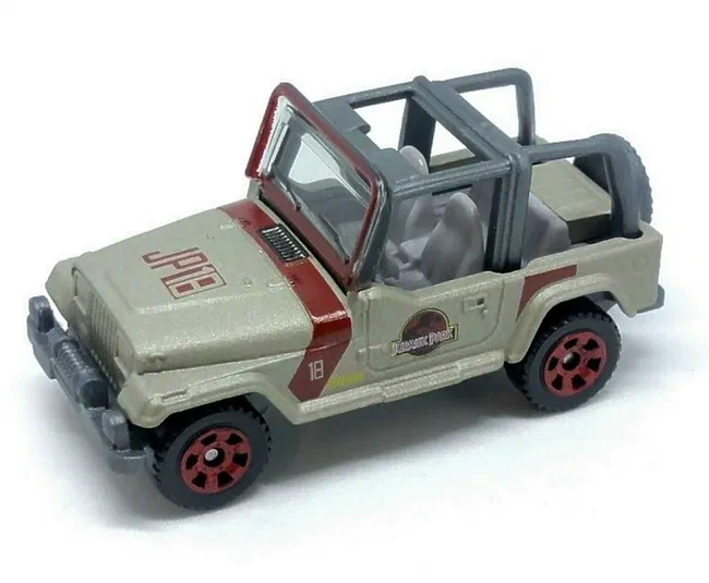 Jouet Matchbox Jeep Wrangler beige avec une bande rouge et le logo Jurassic Park.