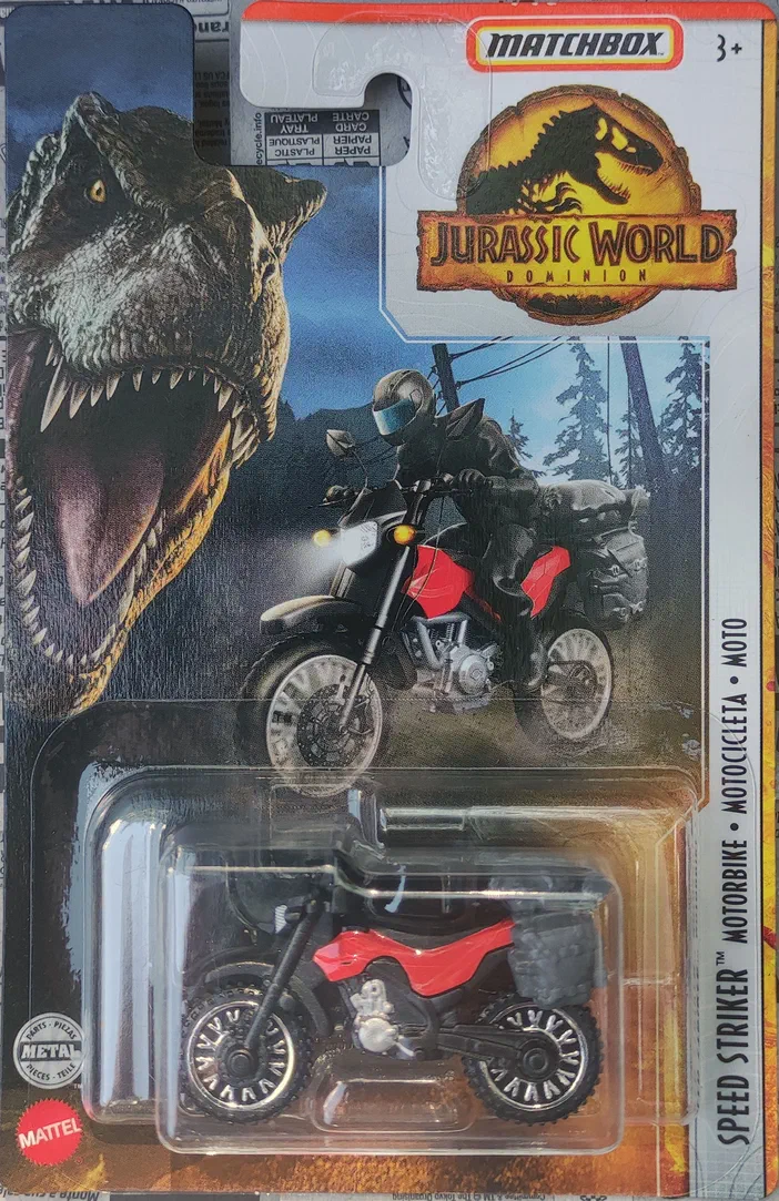 Emballage Matchbox Speed Striker Motorbike Jurassic World Dominion avec un T-Rex et une moto rouge.