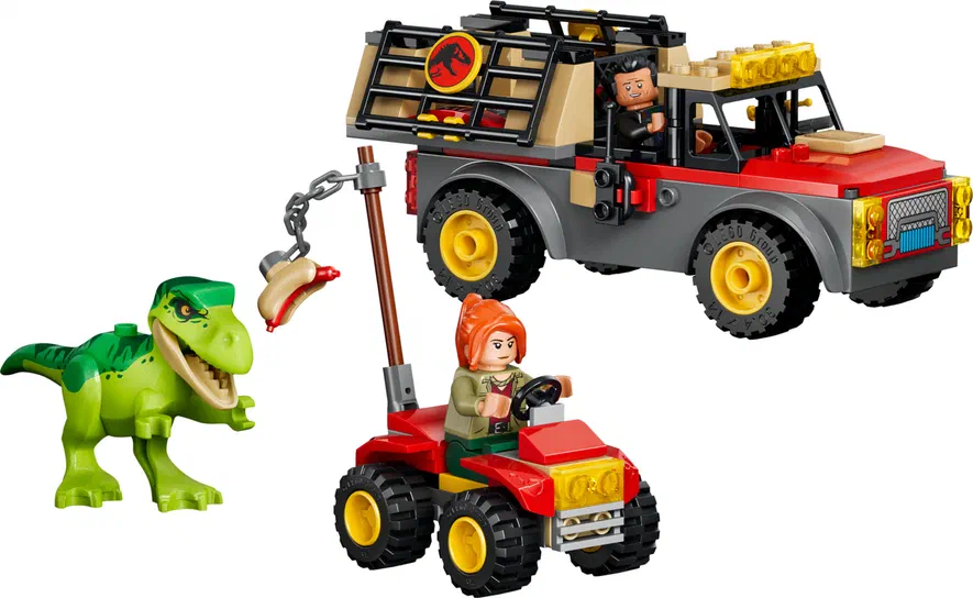 Un ensemble de construction LEGO Jurassic World avec un camion transportant une jeune T. rex et des véhicules tout-terrain.