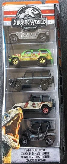 Packaging de Matchbox Jurassic World contenant cinq véhicules terrestres : une InGen Humvee, un Ford Explorer vert, un Mercedes G550 noir, un Jeep Wrangler blanc et un Kawasaki Teryx4 LE.