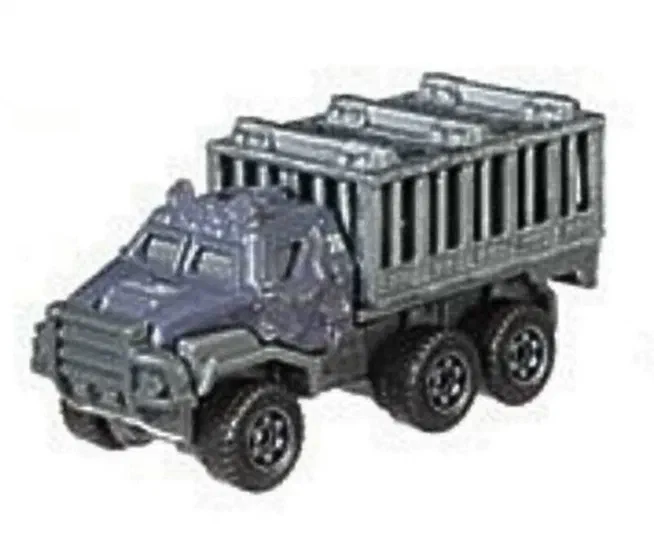 Puce Matchbox Armored Action Transporter gris foncé avec une cabine blindée et un plateau de transport à barreaux.