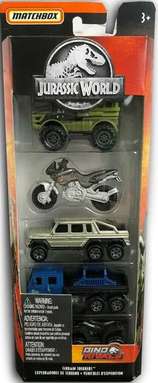 Packaging Matchbox Jurassic World contenant cinq véhicules de terrain : un Unimog, une moto Cagiva, un Mercedes G63 AMG, un véhicule de sauvetage et une Kawasaki Brute Force.