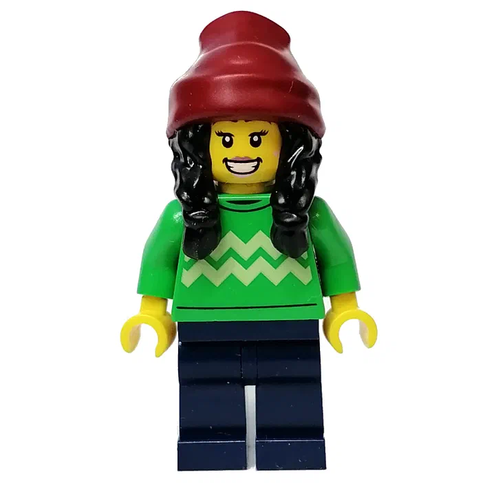 Minifigurine LEGO avec un bonnet rouge, une écharpe verte et des cheveux noirs.