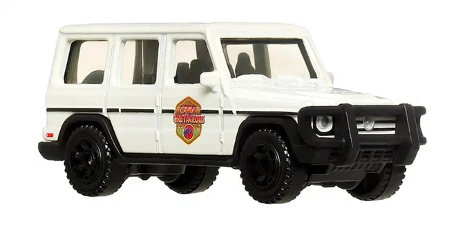 Puce Matchbox blanche de la Mercedes-Benz G-Class avec un logo Jurassic Park sur le côté.